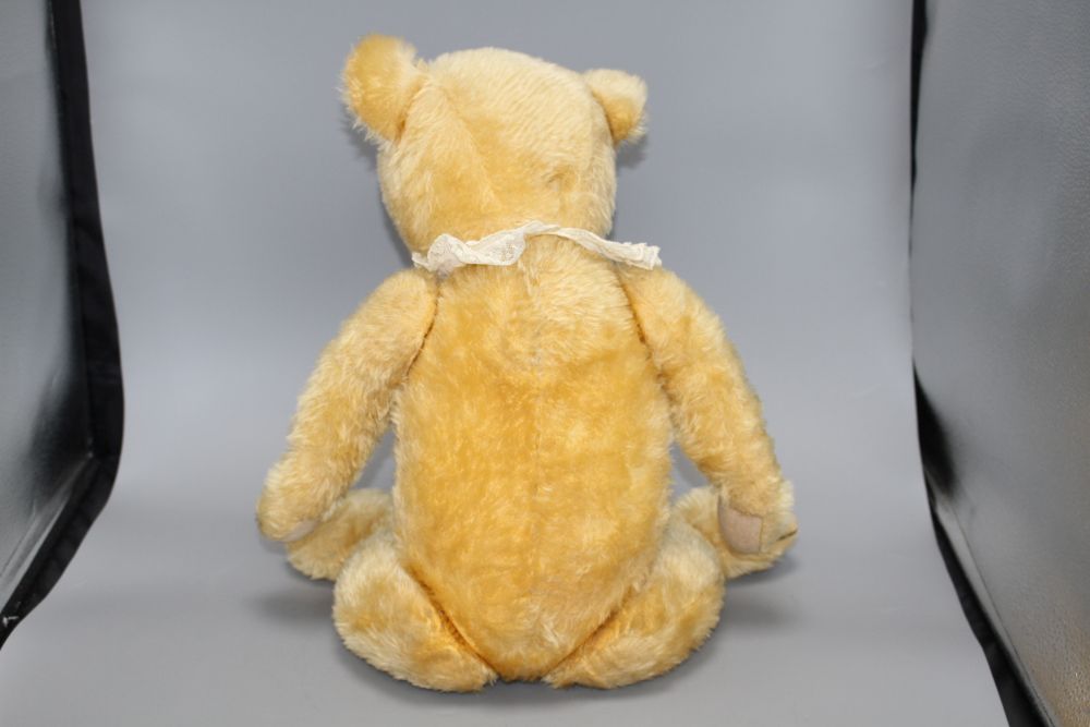 A Chiltern type bear, blond mohair, glass eyes, original pads, some slight staining on centre seam otherwise good condition